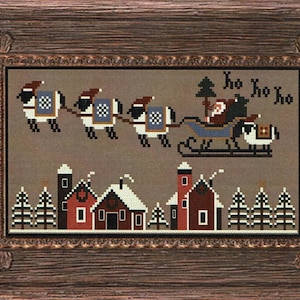 May include: Cross-stitch pattern featuring Santa Claus in a sleigh pulled by sheep, flying over a snowy village with the text "Ho Ho Ho Ho".