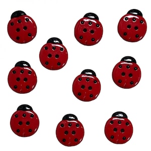 May include: Ten red ladybug buttons with black spots and black heads.
