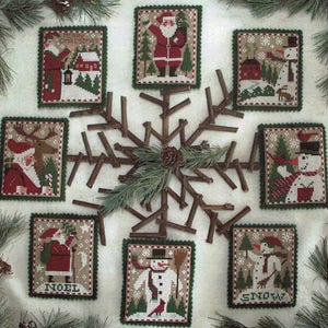 May include: Eight cross-stitch ornaments with a winter theme. The ornaments feature Santa Claus, snowmen, reindeer, and a house. The ornaments are surrounded by a snowflake made of twigs.
