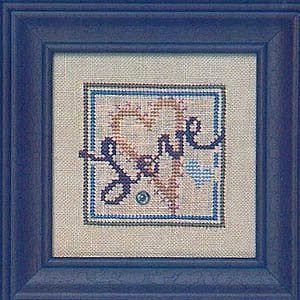 May include: A cross-stitch embroidery with a blue frame, featuring a beige background with two brown hearts and the word "Love" in a blue and brown cursive font.