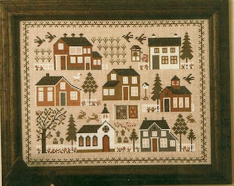 May include: Cross-stitch pattern of a quaint village scene with houses, a church, trees, and birds. The houses are red, white, and brown with white trim. The church is white with a brown steeple. The trees are green and brown. The birds are brown and white.