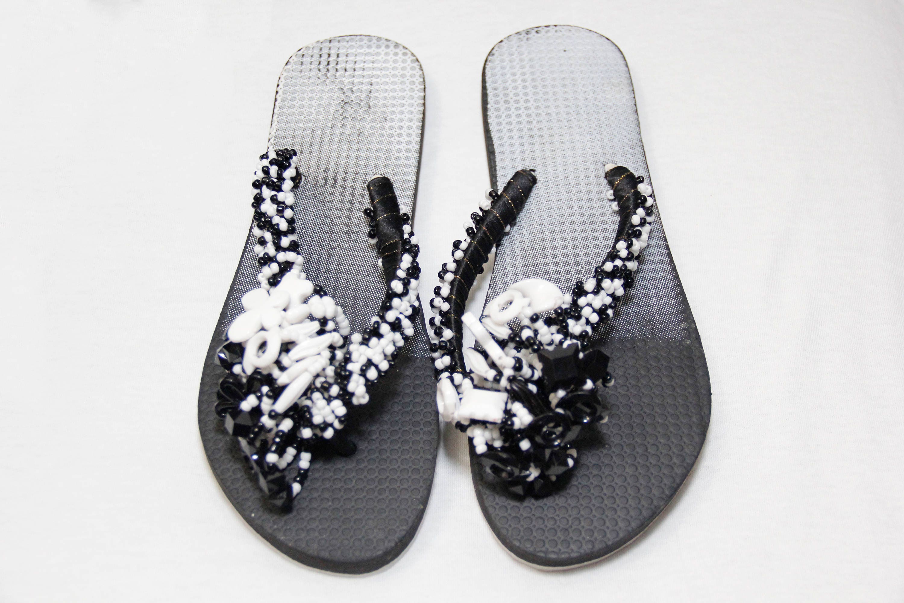 black beaded flip flops