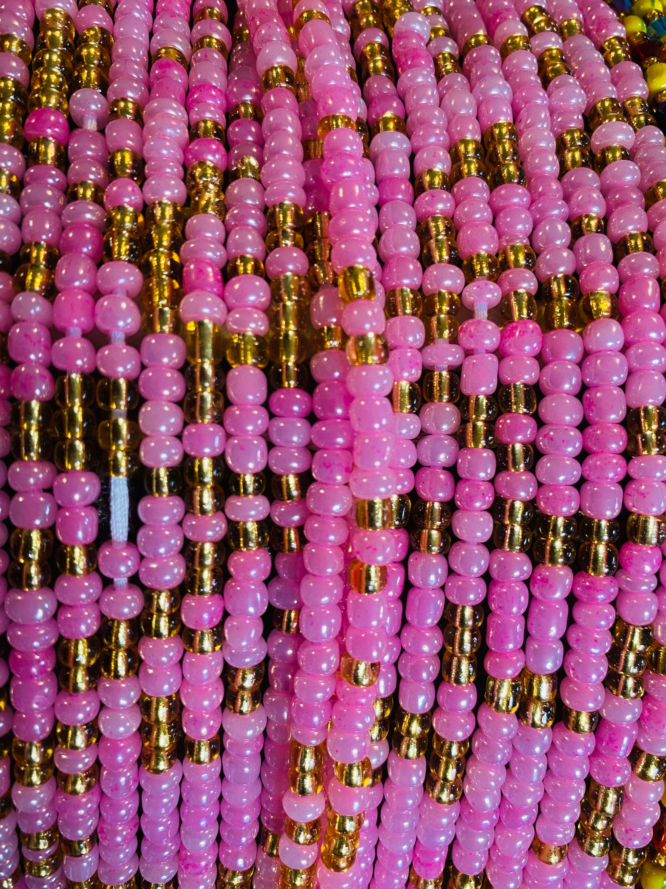 pink and gold waist beads