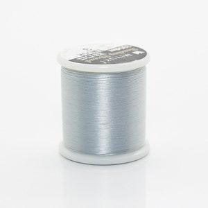May include: A spool of silver thread with the text "Miyuki  Beading Thread  Size C  100% Polyester  Made in Japan" on the label.