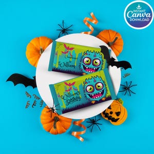 May include: Two Halloween-themed candy bar wrappers with a cartoon monster design, surrounded by pumpkins, spiders, and bats on a blue background. The wrappers say "William's Birthday" and "Cumpleaños de William".