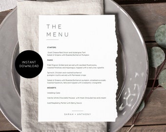 May include: A printable wedding menu template with a rustic design. The menu features a simple black and white design with the words "The Menu" at the top. The menu includes a list of starters, mains, and desserts. The menu is printed on a white background with a torn edge.