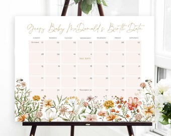May include: A white calendar with a floral border and the text "Guess Baby McDonald's Birth Date". The calendar is for October and November and has a pink box around the due date.