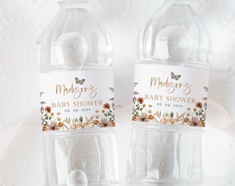 May include: Two clear plastic water bottles with labels that say "Madison's Baby Shower 05.09.2024" with a floral design and butterflies.