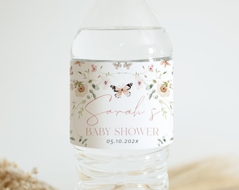 May include: Water bottle label with a floral design and a butterfly. The label says "Sarah's Baby Shower" and "05.10.202X".