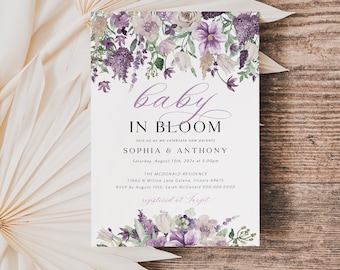 May include: A baby shower invitation with a floral design featuring purple and white flowers. The text reads "baby in bloom" and includes the names "Sophia & Anthony" and the date "Saturday, August 13th, 2023 at 7:00pm".