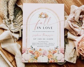 May include: Fall in Love bridal shower invitation with a pink background and gold accents. The invitation features a watercolor illustration of pumpkins, flowers, and leaves. The text reads "Fall in Love" and "Join us as we celebrate bride-to-be Sophia Thompson". The date and time of the shower are listed as "Sat Nov 09 | 3:00PM". The location is "The Stables Cafe, 18564 Yarra Valley Road, Galena, IL". The RSVP information is "RSVP to Courtney at 000.000.0000". The invitation also states that the couple is registered at Target.