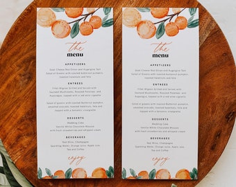 May include: Two white cards with a watercolor illustration of orange branches and leaves. The cards are titled "The Menu" and list appetizers, entrees, desserts, and beverages. The text "enjoy" is written in cursive at the bottom of each card.