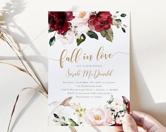 May include: Fall in love bridal shower invitation with a watercolor design of burgundy and pink flowers, a white pumpkin, and gold calligraphy text. The invitation includes the date, time, location, and RSVP information.