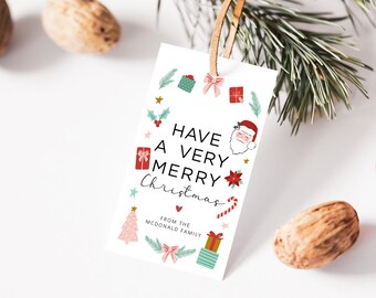 May include: White gift tag with a red and green Christmas wreath design. The tag says "Have a Very Merry Christmas" and "From the McDonald Family".