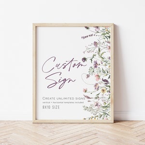 May include: A framed 8x10 inch print with a floral design and the text "Custom Sign" in purple script. The text "Create Unlimited Signs" is below the script, followed by "vertical + horizontal templates included" and "8x10 SIZE".