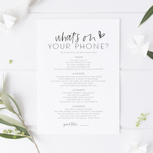 May include: A printable game card with the title "What's on Your Phone?"  The game asks guests to check their phones for various items and awards points for each item found.  The guest with the most points wins.