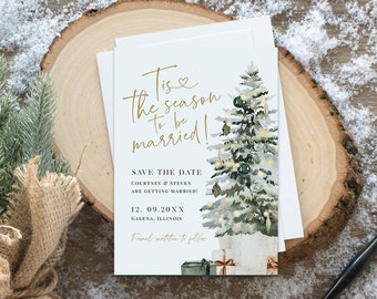 May include: Save the date wedding announcement with a watercolor illustration of a Christmas tree with gold ornaments and lights. The text reads "Tis the season to be married!" and includes the couple's names, wedding date, and location.