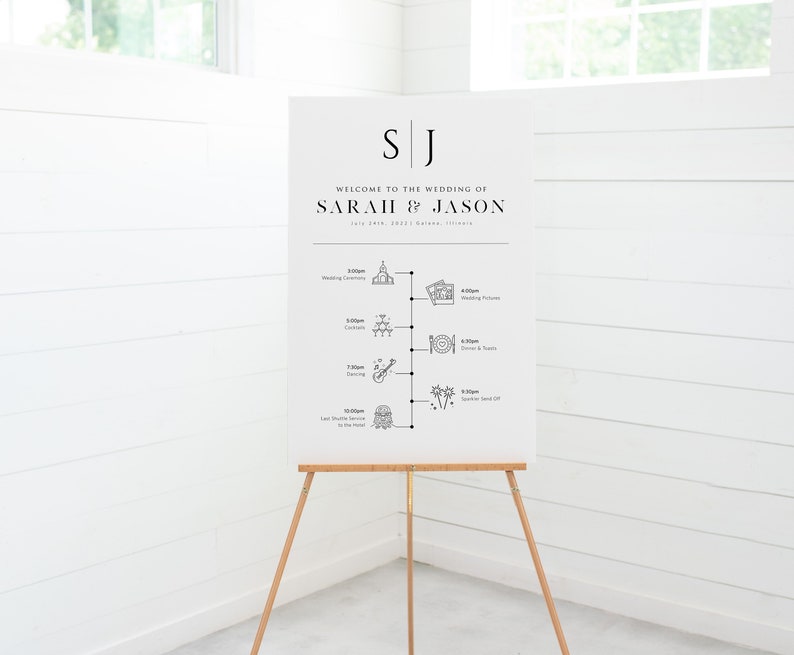 May include: White wedding welcome sign with black text and icons. The sign reads "Welcome to the wedding of Sarah & Jason" and lists the wedding day schedule with times and icons for each event.