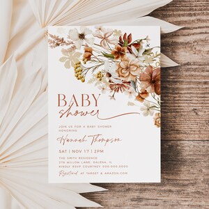 May include: A white baby shower invitation with a floral design in shades of brown, orange, and yellow. The text reads "BABY shower" in brown lettering and "JOIN US FOR A BABY SHOWER HONORING Hannah Thompson SAT NOV 17 2PM THE SMITH RESIDENCE 276 WILLOW LANE, GALENA, IL KINDLY RSVP COURTNEY 000 000 0000 Rfid AT TARGET & AMAZON.COM".
