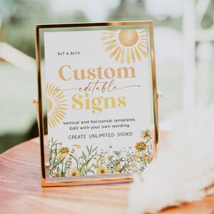 May include: A gold-framed sign with a white background and a yellow sun graphic. The text on the sign reads "Custom editable Signs" and "Vertical and horizontal templates. Edit with your own wording. CREATE UNLIMITED SIGNS!"
