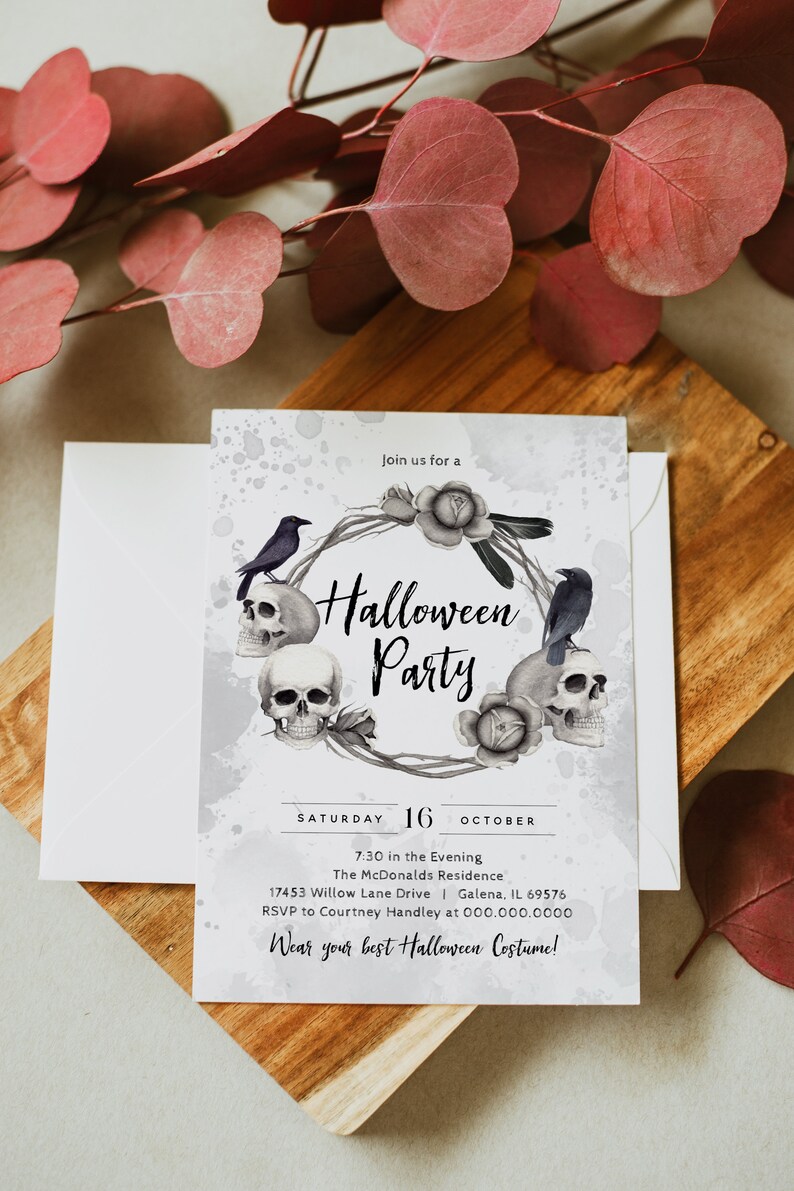 May include: A Halloween party invitation with a watercolor background featuring a wreath of skulls, ravens, and roses. The text reads "Join us for a Halloween Party" and includes the date, time, location, and RSVP information.