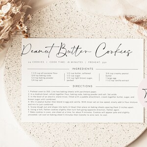 May include: Printable recipe card for peanut butter cookies. The card is white with black text and includes a list of ingredients and directions. The card also includes the text "14 cookies | Cook time: 18 minutes | Preheat 350".