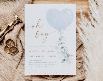 May include: A baby shower invitation with a blue heart-shaped balloon and gold lettering that reads "Oh boy". The invitation includes the name "madison thompson" and the date and time of the shower. The invitation also includes the location of the shower, The Stables Cafe, and the RSVP information.