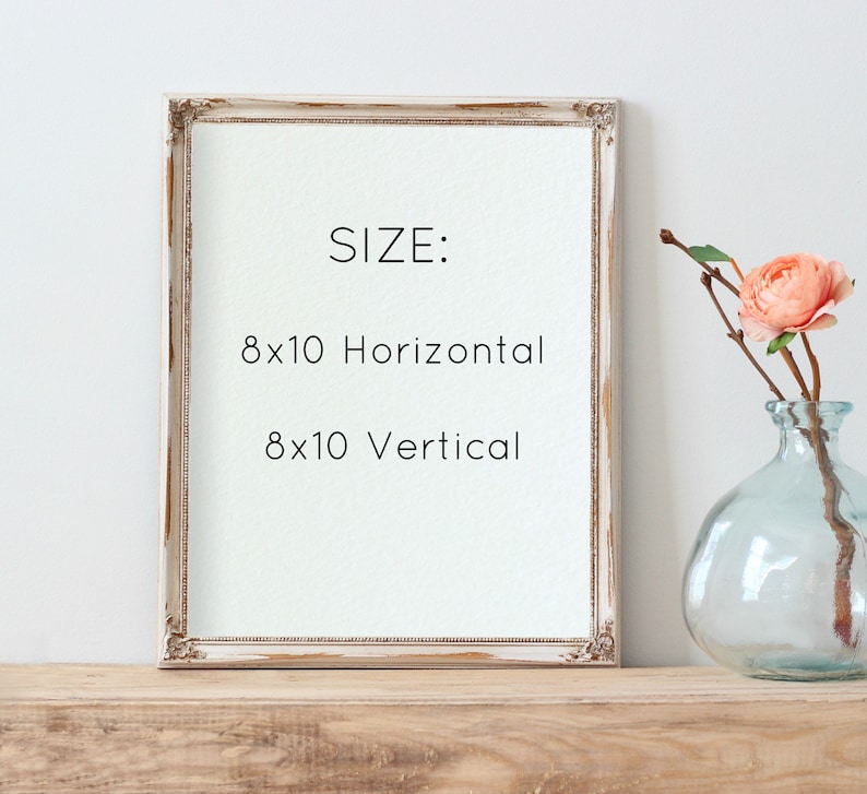 May include: A white wood picture frame with a distressed finish. The frame is sitting on a wooden surface. The text inside the frame reads "SIZE: 8x10 Horizontal 8x10 Vertical".
