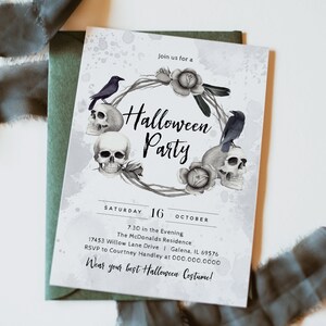 May include: A Halloween party invitation with a black and white watercolor design featuring skulls, crows, and roses. The text reads "Join us for a Halloween Party" and includes the date, time, and location of the event. It also encourages guests to wear their best Halloween costume.