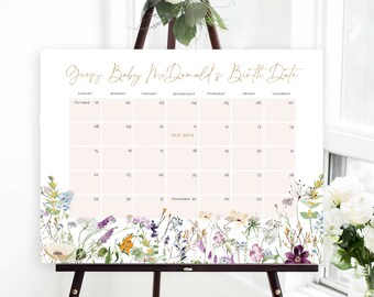 May include: A white calendar with a floral border and the text "Guess Baby McDonald's Birth Date". The calendar is for October and November and has a pink background for the dates.
