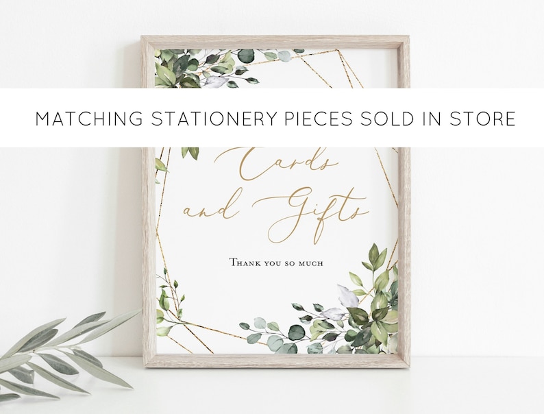 May include: A framed sign with the words "Cards and Gifts" in gold script. The sign is decorated with green and white botanical elements and gold geometric accents. The text "Thank you so much" is at the bottom.