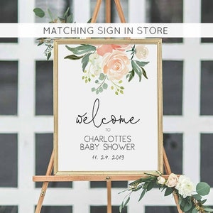 May include: A welcome sign for a baby shower with a floral design in shades of pink and green. The sign reads "Welcome to Charlotte's Baby Shower 11.24.2019".