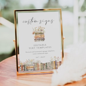 May include: A gold-framed sign with the words "custom signs" in elegant script. The sign features a watercolor illustration of books and flowers. Text below reads "EDITABLE TEXT TEMPLATES" and "5x7 | 8x10".