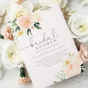May include: A white card with a floral design and the text "bridal shower" in black script. The text "Please join us as we honor Elizabeth Anderson" is also in black script. The card includes the date, time, and location of the bridal shower, as well as the RSVP information and where the bride is registered.