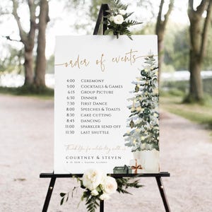 May include: A white sign with a watercolor illustration of a Christmas tree and presents. The sign lists the order of events for a wedding reception, including the ceremony, cocktails, dinner, and dancing. The text reads "order of events" and "Thank You for celebrating with us Courtney & Steven 8.19.2020 Galena, Illinois".