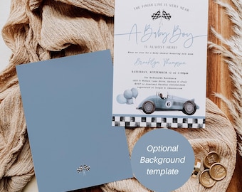 May include: Baby shower invitation with a vintage race car illustration. The invitation is light blue with the text "A Baby Boy is Almost Here!" and includes event details. A matching blue envelope is also included.