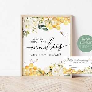 May include: A printable baby shower game sign with a honeycomb and floral design. The sign says "Guess how many candies are in the jar?" and includes a bee illustration. There is also a printable guest card that says "Guess how many candies are in the jar?" with a space for the guest's name and guess.