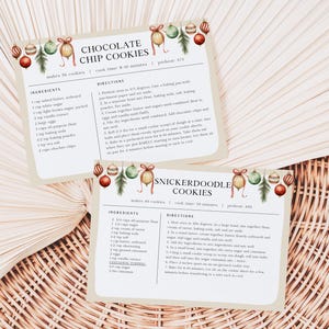 May include: Two printable recipe cards with Christmas-themed illustrations. The top card is for chocolate chip cookies and the bottom card is for snickerdoodle cookies. Both cards include ingredients and directions.