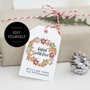 May include: White gift tag with a red and white string tied around it. The tag has a drawing of a wreath made of gingerbread cookies with the text "baked with love". The text "With love from The McDonalds" is printed below the wreath.