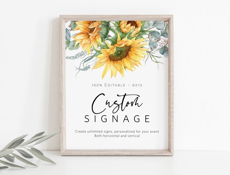 May include: A framed printable sign with a sunflower and eucalyptus design. The text on the sign reads "100% Editable - 8x10 Custom Signage Create unlimited signs, personalized for your event Both horizontal and vertical"