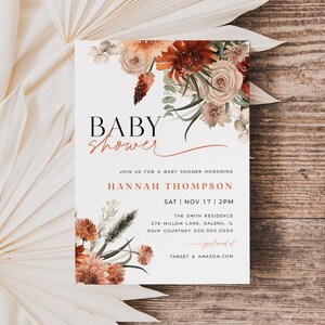 May include: A white baby shower invitation with a floral design in shades of orange, red, and brown. The text reads "BABY shower" in black and "JOIN US FOR A BABY SHOWER HONORING HANNAH THOMPSON SAT | NOV 17 | 2PM THE SMITH RESIDENCE 276 HILLOW LANE, GALENA, IL RSVP COURTNEY 000.000.0000 registered at TARGET & AMAZON.COM"