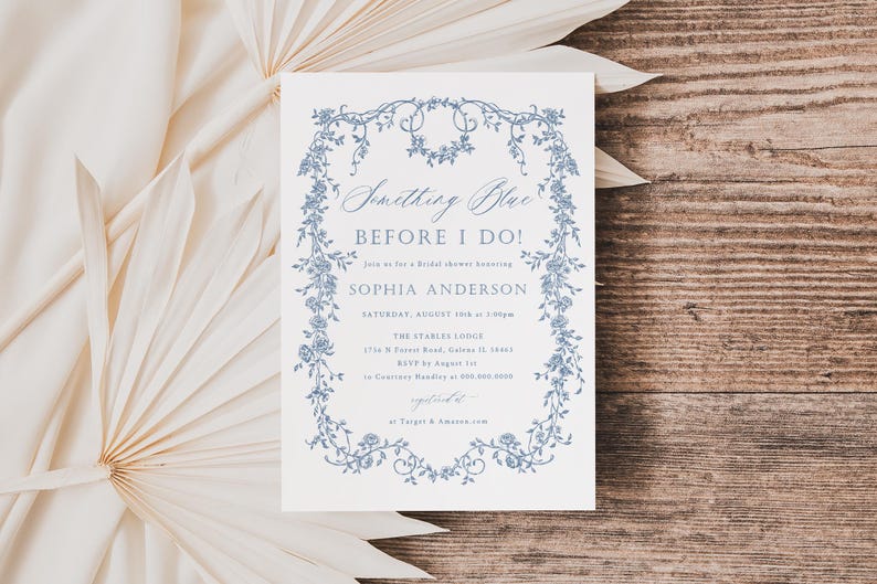 May include: A white invitation with blue floral border and text that reads "Something Blue Before I Do!" Join us for a bridal shower honoring Sophia Anderson. Saturday, August 1st at 1:00pm. The Starless Lodge 1714 W Forest Road, Salem, IL 62881 RSVP by August 1st to Caroline Hadley at 555-555-5555. Registered at Target & Amazon.com