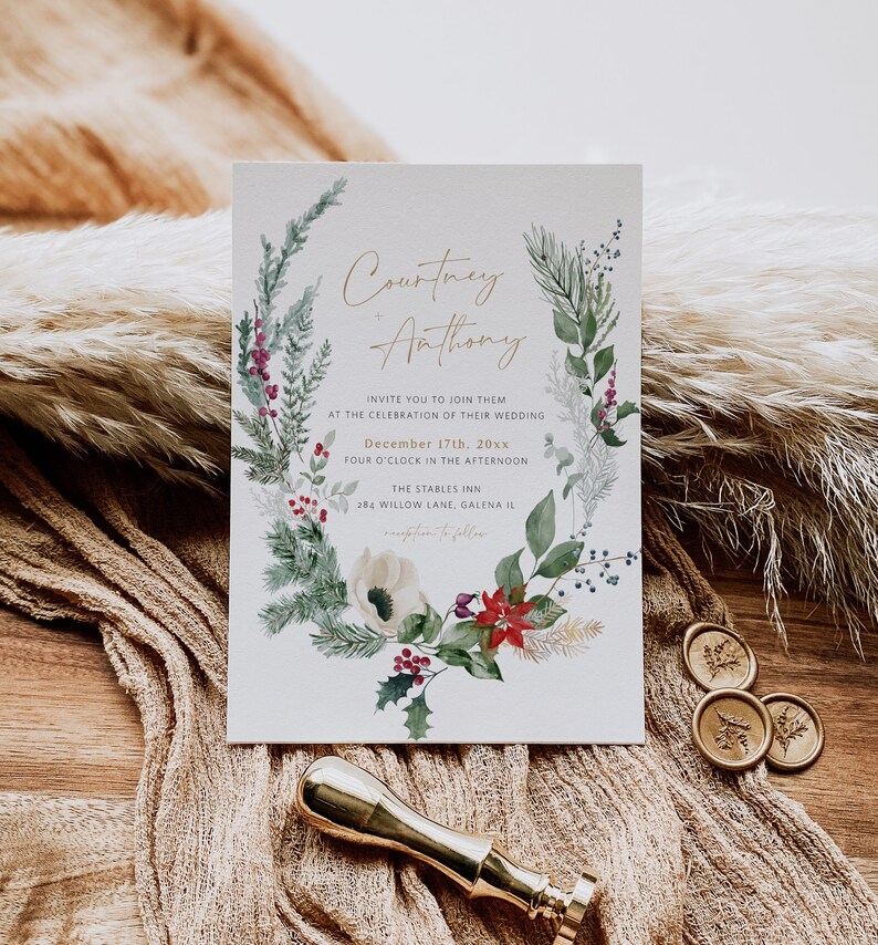 May include: A wedding invitation with a watercolor illustration of a winter floral wreath. The invitation is for Courtney and Anthony's wedding on December 17th, 20xx at The Stables Inn in Galena, Illinois.