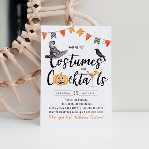 May include: A white invitation card with black and orange text that reads "Join us for Costumes and Cocktails". The card features a black crow, a witch's hat, a jack-o-lantern, and a cocktail glass with a lemon slice. The date is Saturday, October 29th. The event is at 7:30 in the evening at The McDonalds Residence, 17453 Willow Lane Drive, Galena, IL 69576. The RSVP is to Courtney Handley at 000.000.0000. The invitation ends with "Wear your best Halloween Costume!"