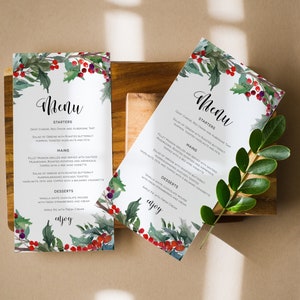 May include: A watercolor menu design with a festive holly and berry motif. The menu features a selection of starters, mains, and desserts. The text reads "Menu", "Starters", "Mains", "Desserts", and "Enjoy".