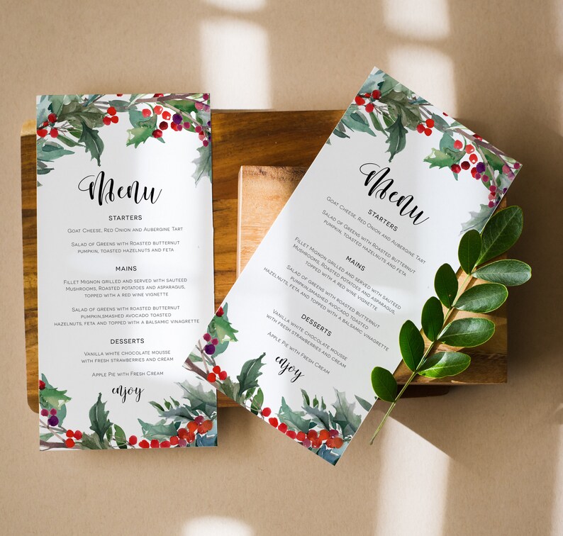 May include: A watercolor menu design with a festive holly and berry motif. The menu features a selection of starters, mains, and desserts. The text reads "Menu", "Starters", "Mains", "Desserts", and "Enjoy".