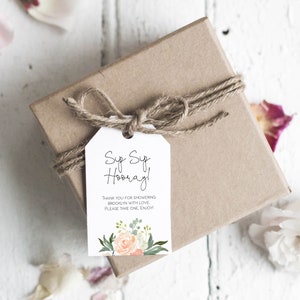 May include: A white gift tag with a floral design and the text "Sup Sup Hooray! Thank you for showering Brooklyn with love. Please take one, enjoy!"