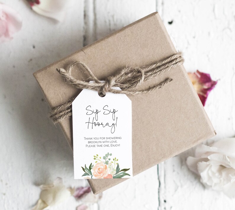 May include: A white gift tag with a floral design and the text "Sup Sup Hooray! Thank you for showering Brooklyn with love. Please take one, enjoy!"
