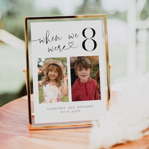 May include: A framed photo print with the text "when we were 8" and two photos of children. The print is in a gold frame and includes the names "Courtney and Anthony" and the date "07.21.202X".