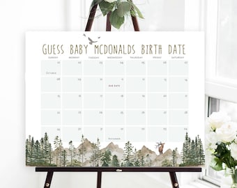 May include: A white calendar with a green and brown watercolor mountain and forest design. The calendar is titled "Guess Baby McDonalds Birth Date" and has the months of October and November with the days of the week listed. The due date is marked on the calendar.